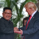 North Korean leader Kim Jong Un shakes hands with President Donald Trump during their historic summit at the Capella Hotel on Sentosa island on June 12, 2018, in Singapore.